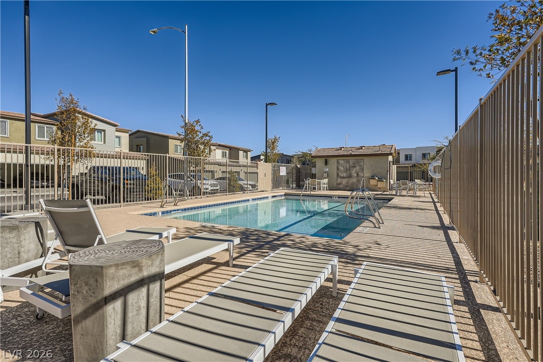 527 Clearsable Avenue Henderson, NV 89044 - Photo 10 of 11 Community pool featuring a residential view and a patio