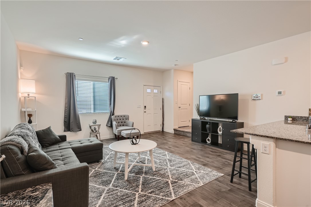 527 Clearsable Avenue Henderson, NV 89044 - Photo 2 of 11 Living room with dark wood-type flooring and baseboards