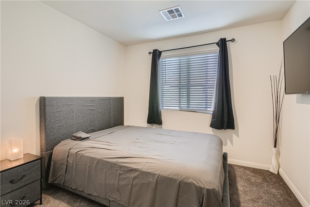 527 Clearsable Avenue Henderson, NV 89044 - Photo 6 of 11 Bedroom featuring carpet flooring and baseboards