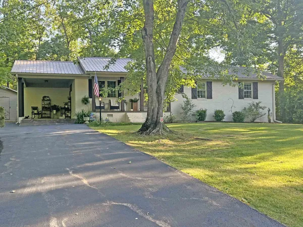 a view of a house with a swimming pool