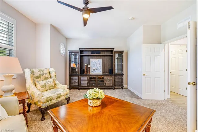 a living room with furniture and window