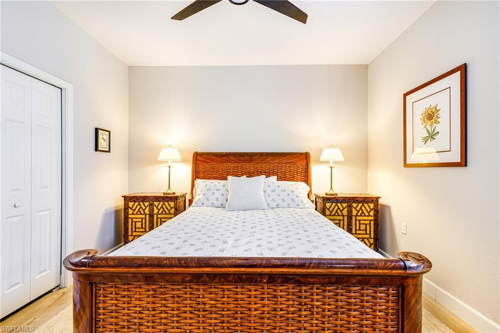 19081 Ridgepoint Drive, Unit 202 Estero, FL 33928 - Photo 12 of 50 a bedroom with a bed and dresser