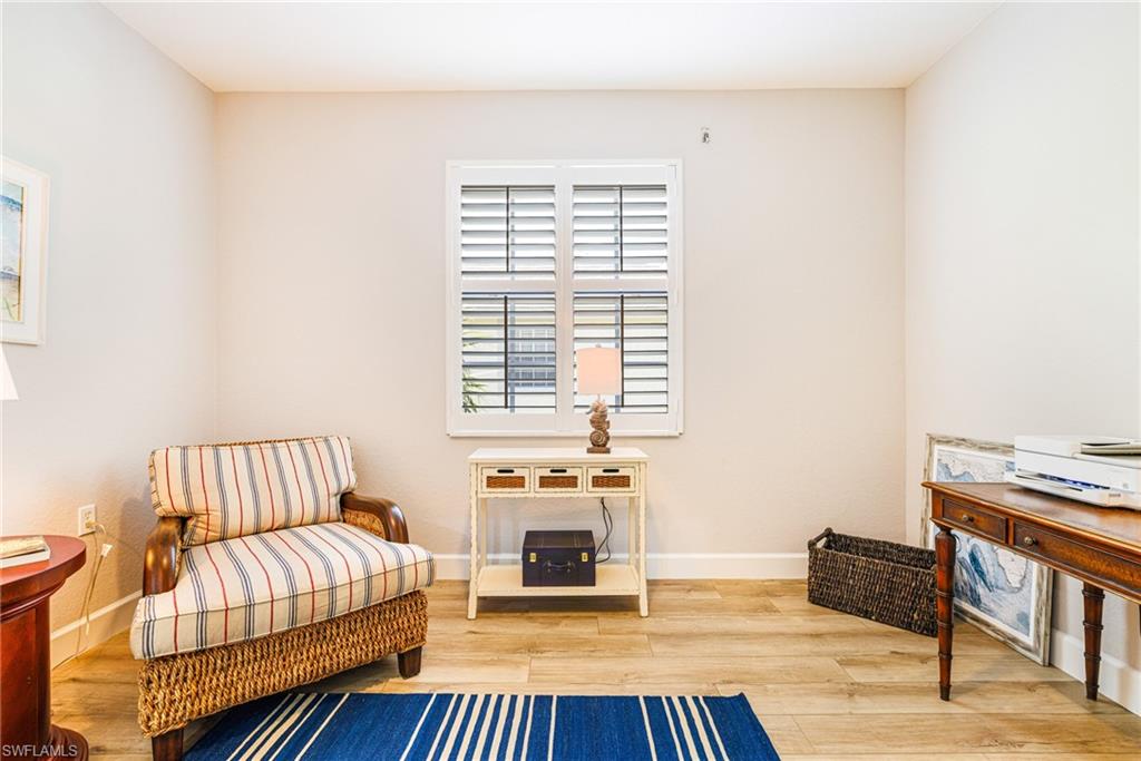 19081 Ridgepoint Drive, Unit 202 Estero, FL 33928 - Photo 20 of 50 a living room with furniture and a fireplace