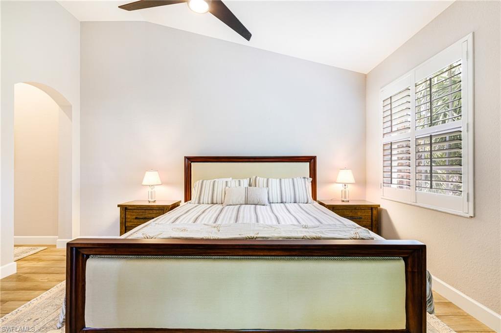 19081 Ridgepoint Drive, Unit 202 Estero, FL 33928 - Photo 22 of 50 a bed sitting in a bedroom next to a window