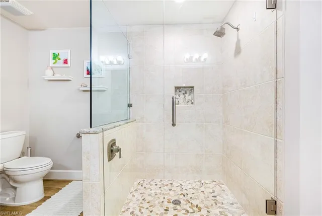 a bathroom with a bathtub and shower