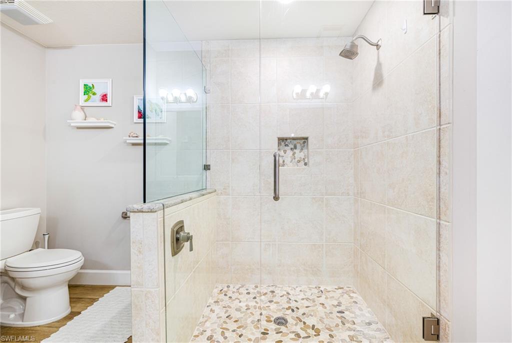 19081 Ridgepoint Drive, Unit 202 Estero, FL 33928 - Photo 25 of 50 a bathroom with a bathtub and shower