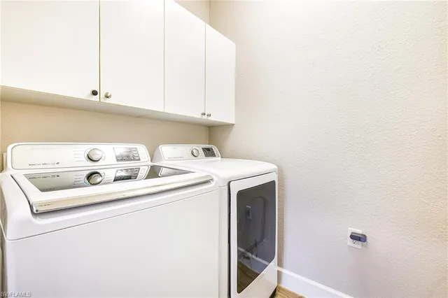 an entryway of a house with potted plants
