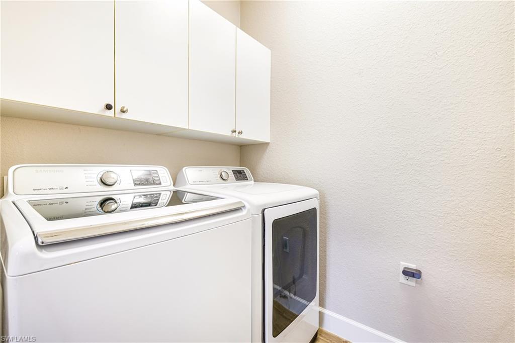 19081 Ridgepoint Drive, Unit 202 Estero, FL 33928 - Photo 30 of 50 a utility room with dryer and washer