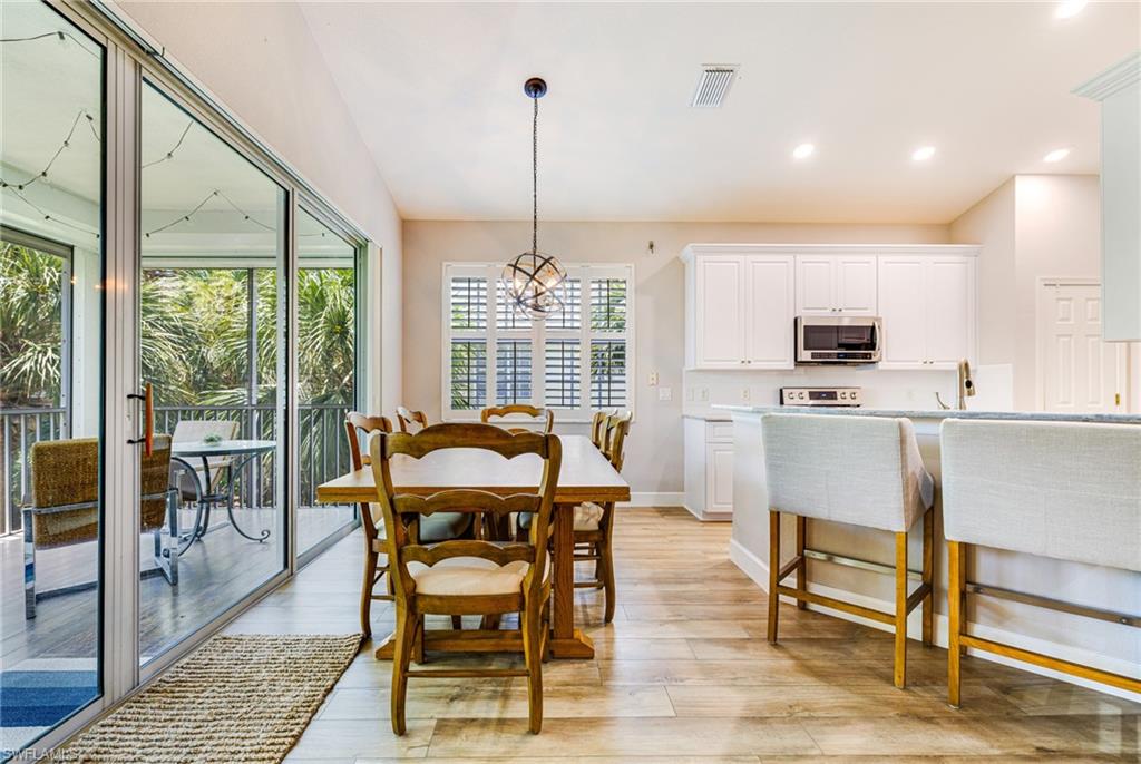 19081 Ridgepoint Drive, Unit 202 Estero, FL 33928 - Photo 4 of 50 a view of a dining room with furniture window and outside view