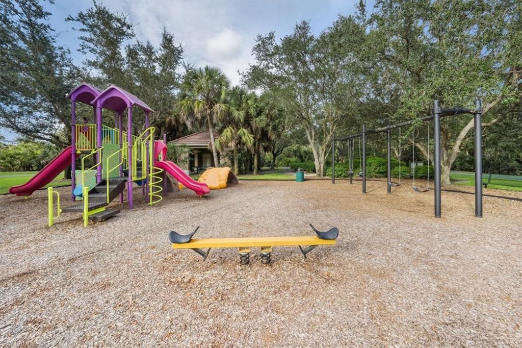 19081 Ridgepoint Drive, Unit 202 Estero, FL 33928 - Photo 48 of 50 a view of park with swings