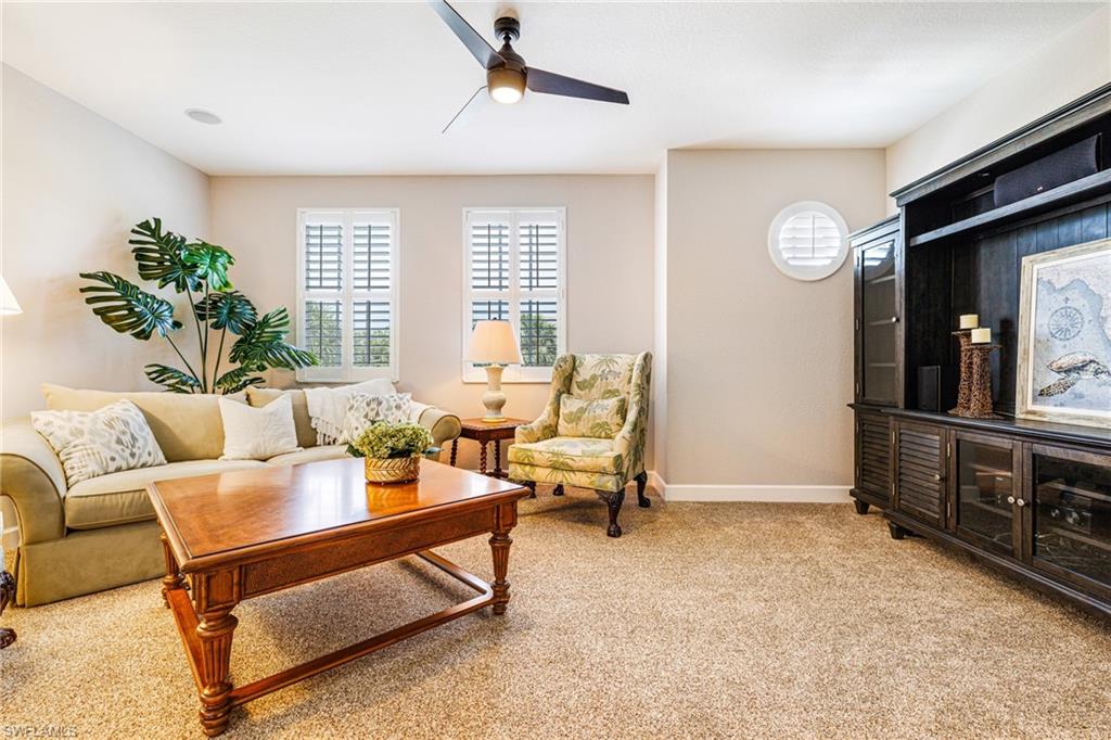 19081 Ridgepoint Drive, Unit 202 Estero, FL 33928 - Photo 9 of 50 a living room with furniture