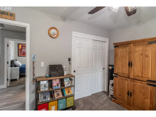 a living room with furniture and a bookshelf