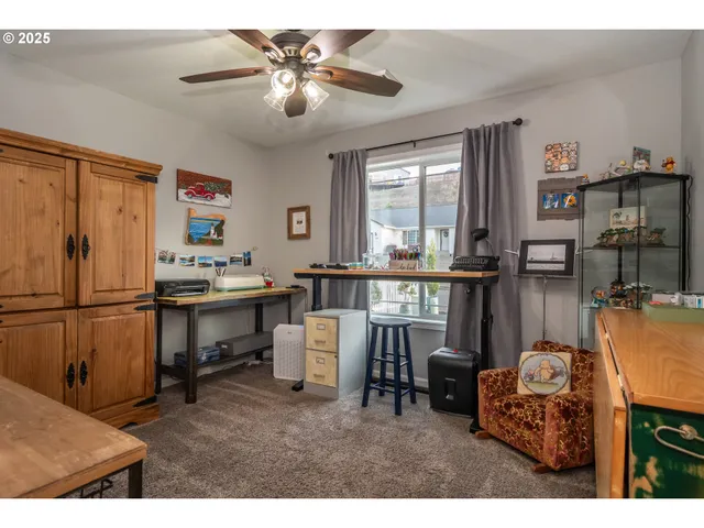 a living room with furniture a window and kitchen view