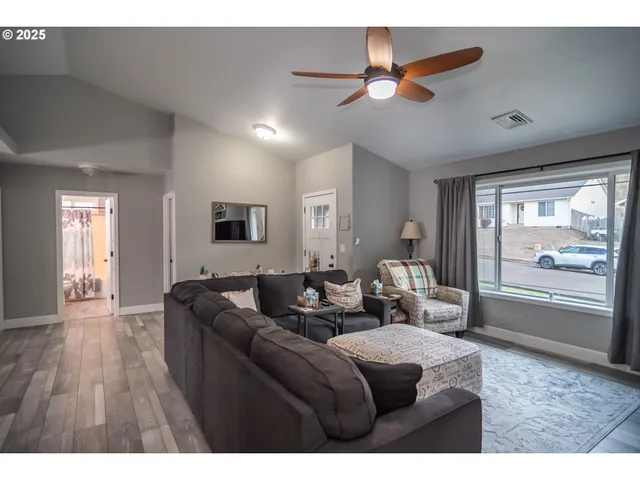 a living room with furniture and a window