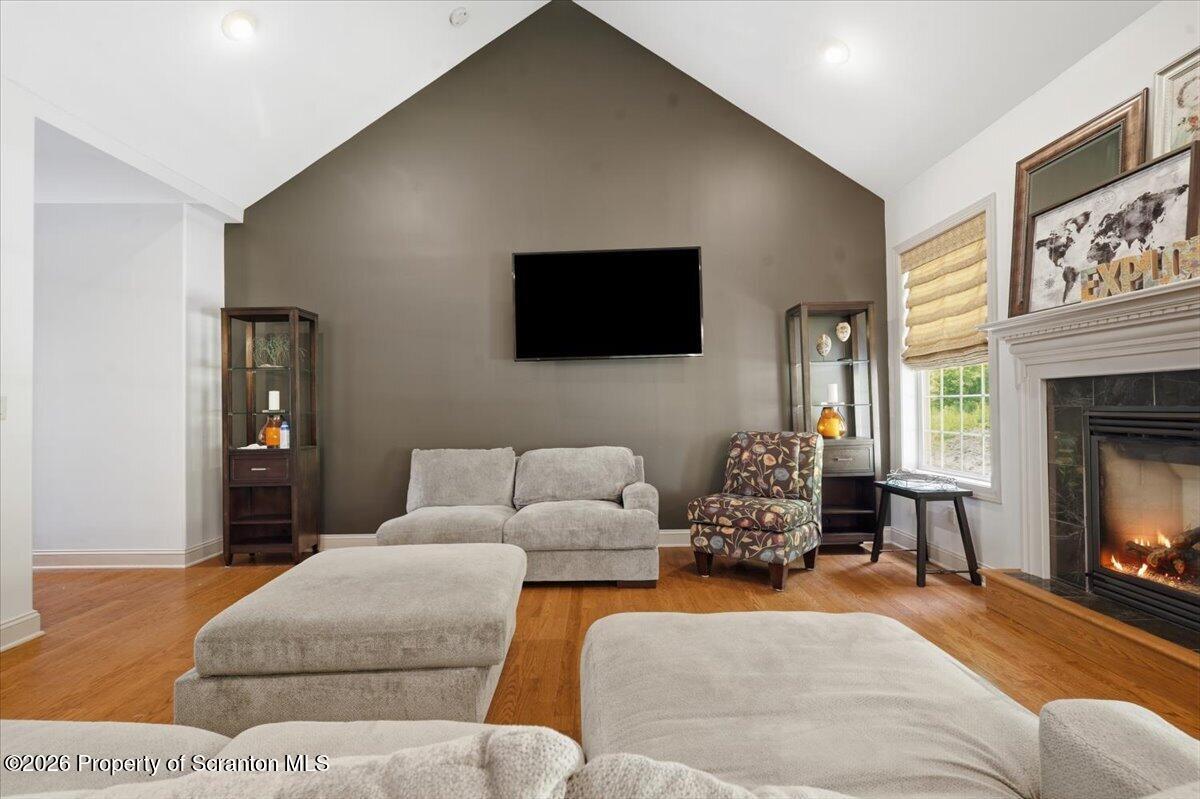 99 Hilltop Road Waverly, PA 18471 - Photo 7 of 41 a living room with furniture and a flat screen tv