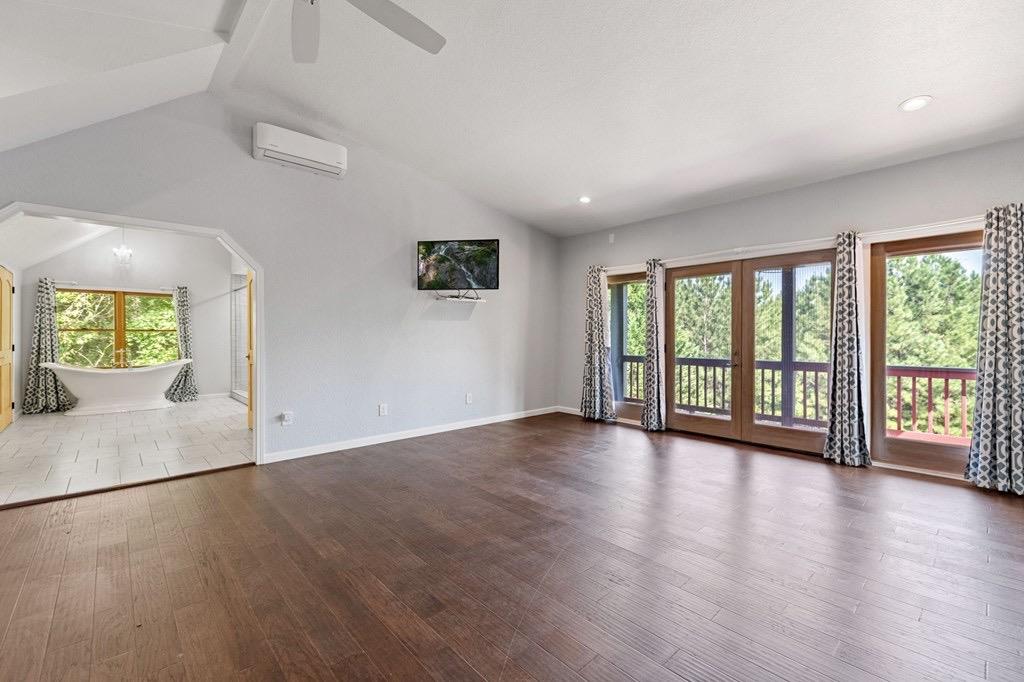 271 Postelle Road Copperhill, TN 37317 - Photo 19 of 59 an empty room with large windows and wooden floor