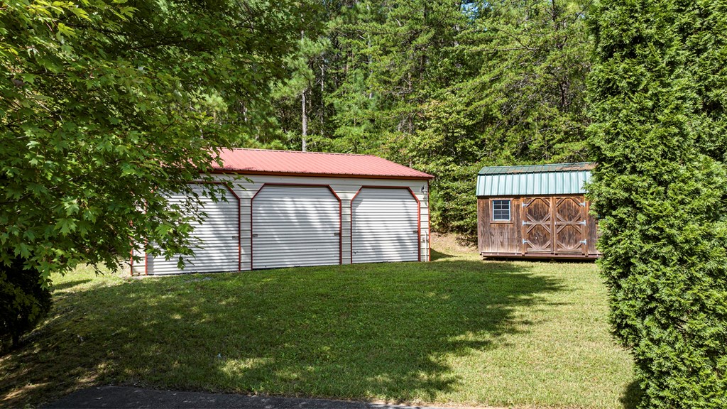271 Postelle Road Copperhill, TN 37317 - Photo 38 of 59 a view of a house with a yard
