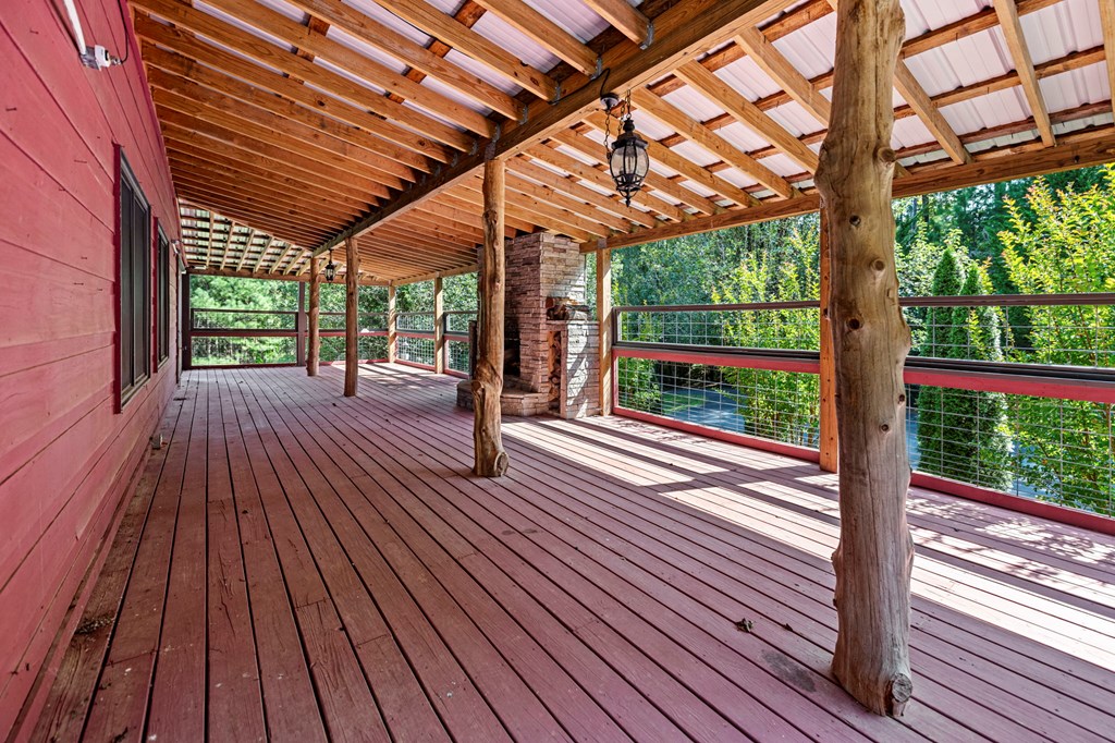 271 Postelle Road Copperhill, TN 37317 - Photo 39 of 59 a view of backyard with a deck and wooden floor
