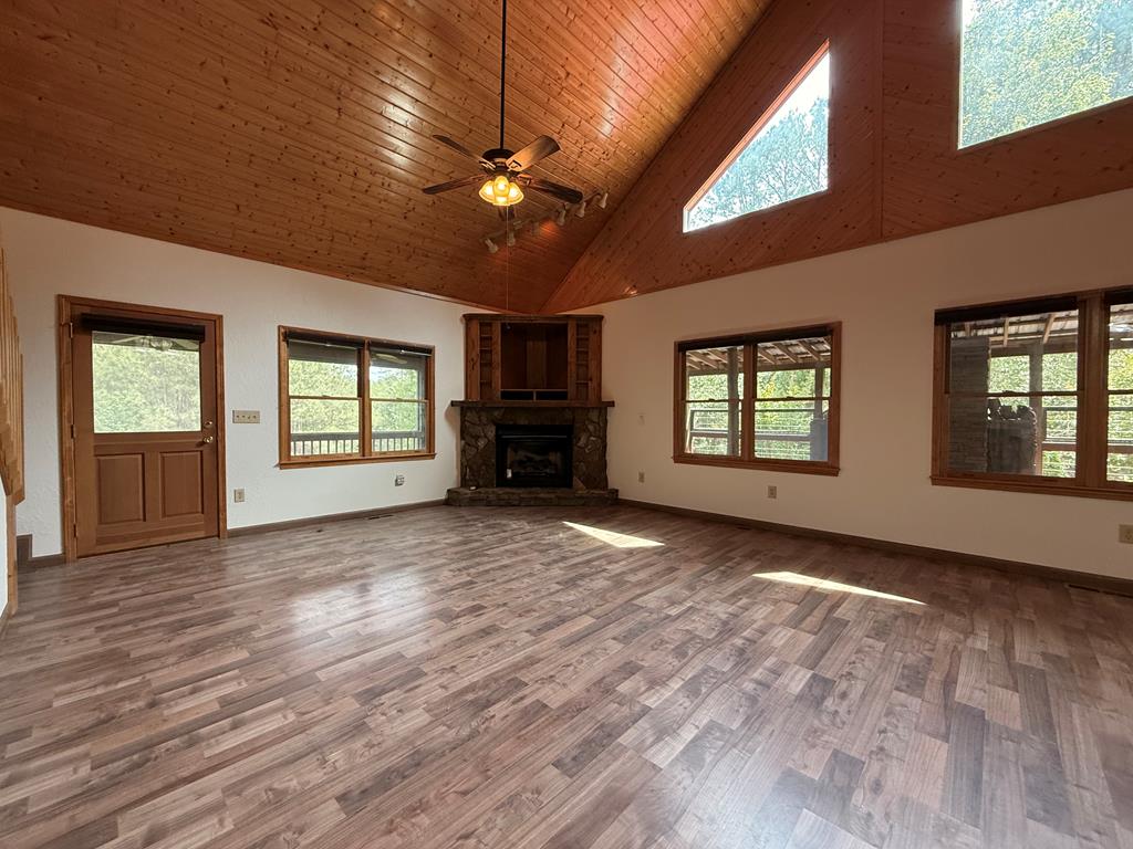 271 Postelle Road Copperhill, TN 37317 - Photo 4 of 59 a view of empty room with wooden floor and fan