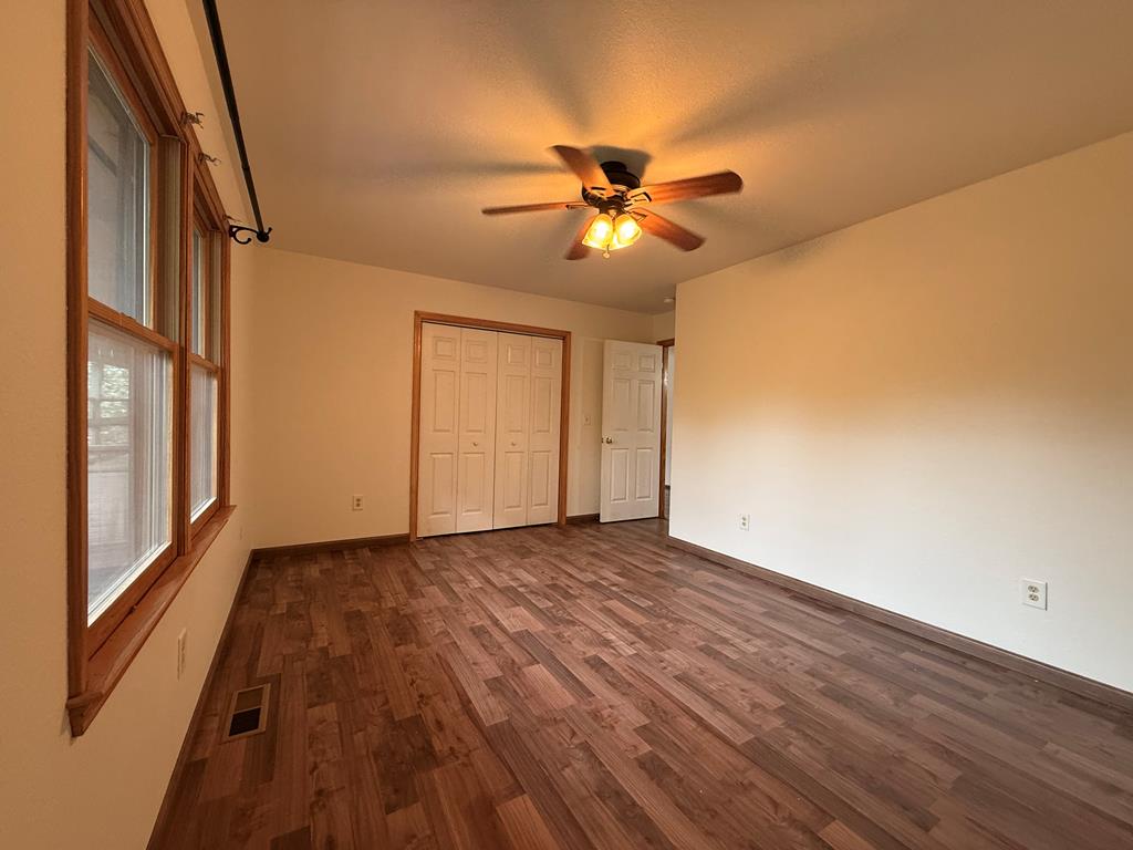 271 Postelle Road Copperhill, TN 37317 - Photo 9 of 59 a view of empty room with wooden floor and fan