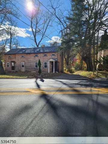 a view of street with large trees