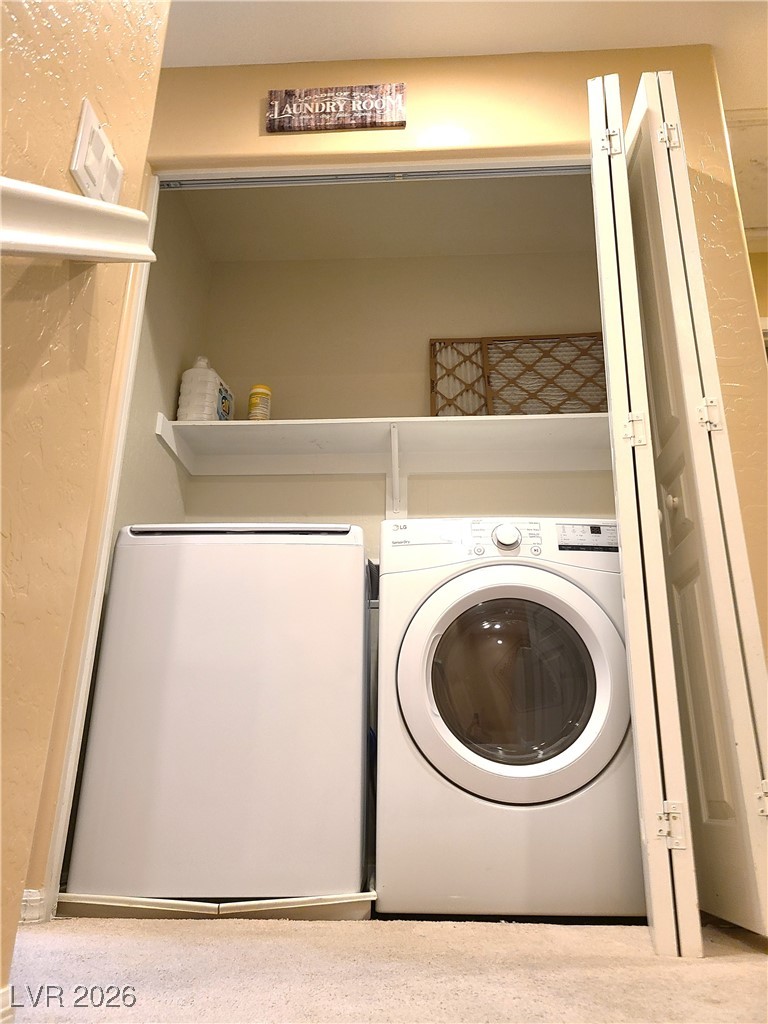 4650 Ranch House Road, Unit 70 North Las Vegas, NV 89031 - Photo 13 of 28 Washroom featuring separate washer and dryer and carpet
