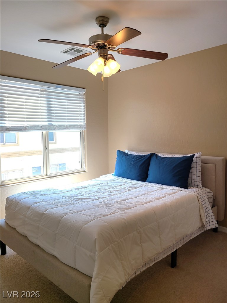 4650 Ranch House Road, Unit 70 North Las Vegas, NV 89031 - Photo 21 of 28 Bedroom with carpet and ceiling fan