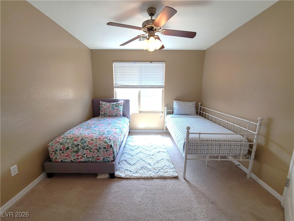 4650 Ranch House Road, Unit 70 North Las Vegas, NV 89031 - Photo 22 of 28 Carpeted bedroom featuring baseboards and a ceiling fan