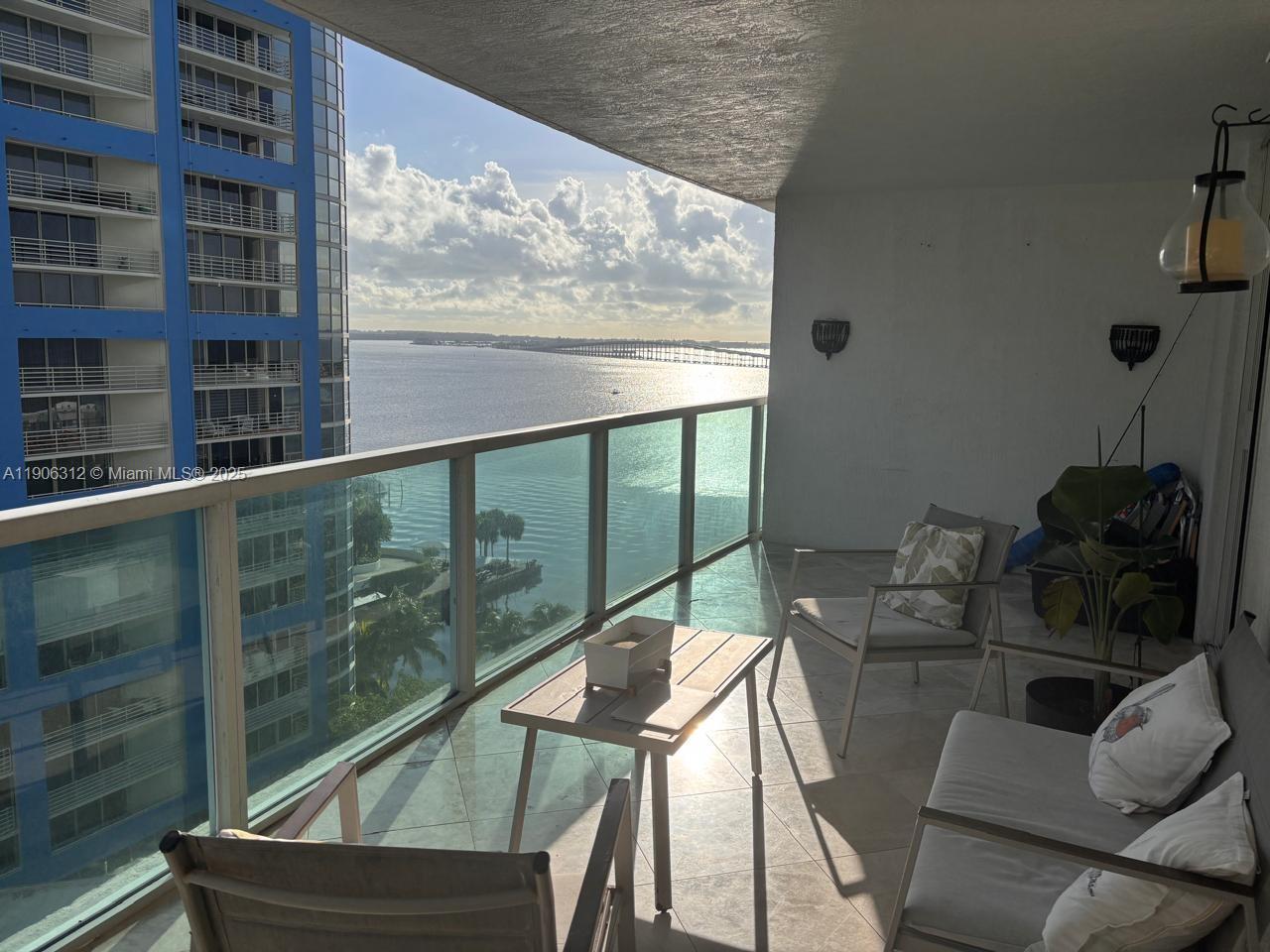 2101 Brickell Avenue, Unit 903 Miami, FL 33129 - Photo 11 of 20 a view of a balcony with chairs