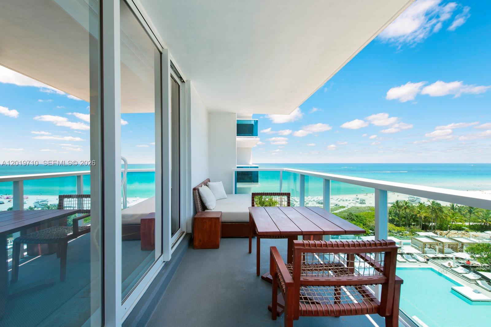 102 24th Street, Unit 1012 Miami Beach, FL 33139 - Photo 3 of 17 a patio with table and chairs