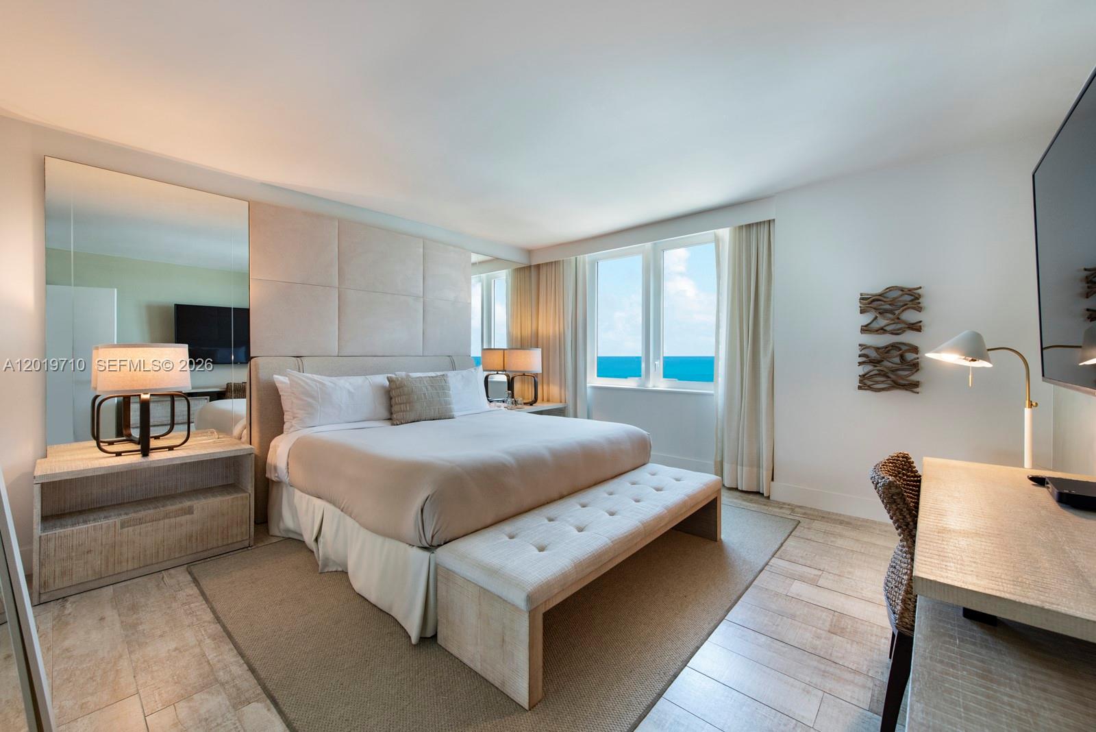 102 24th Street, Unit 1012 Miami Beach, FL 33139 - Photo 4 of 17 a bedroom with bed and window