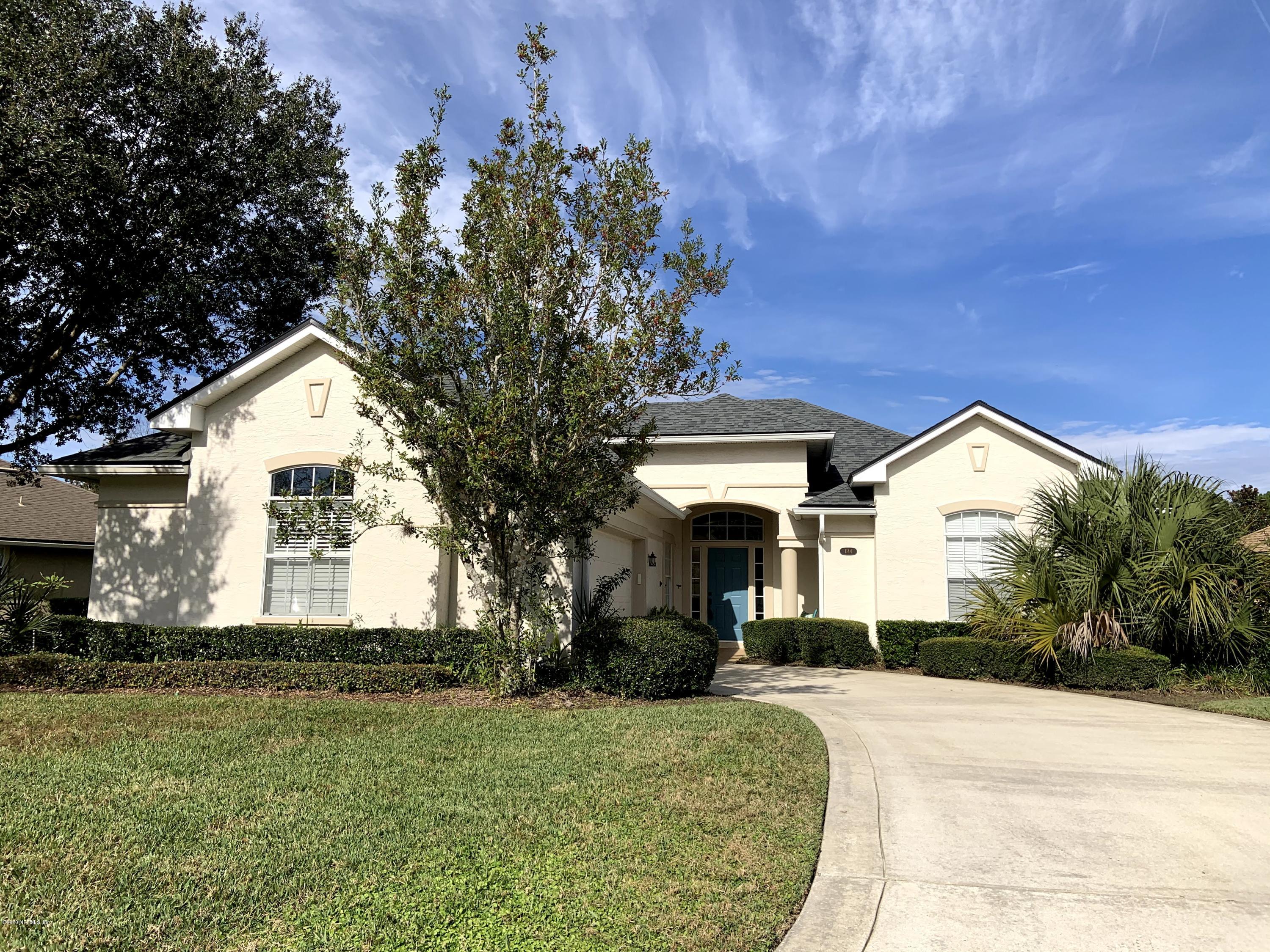 1144 Sandlake Road St. Augustine, FL 32092 - Photo 1 of 11 a front view of a house with a yard and garage