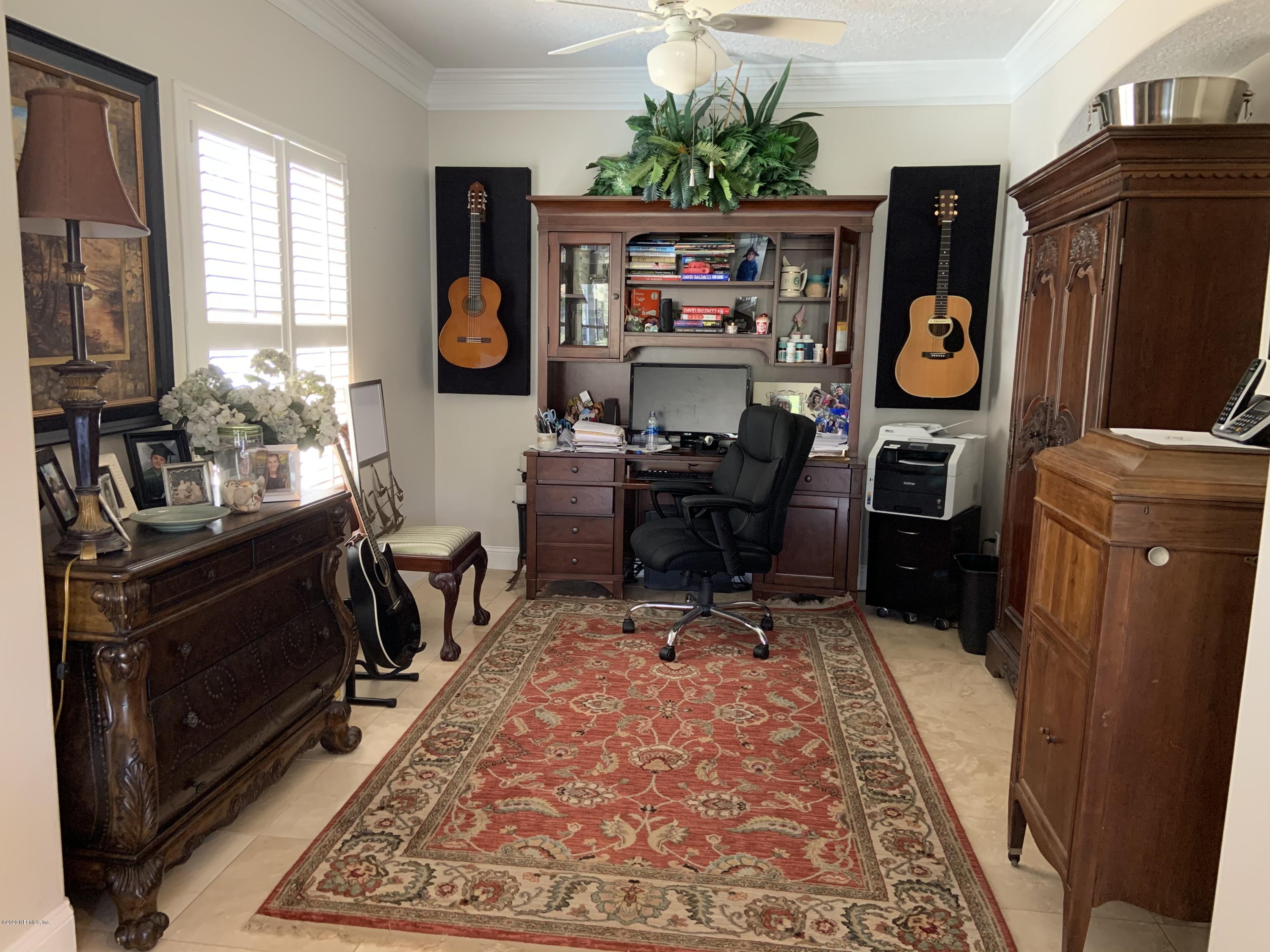 1144 Sandlake Road St. Augustine, FL 32092 - Photo 9 of 11 a living room with furniture a rug and a window