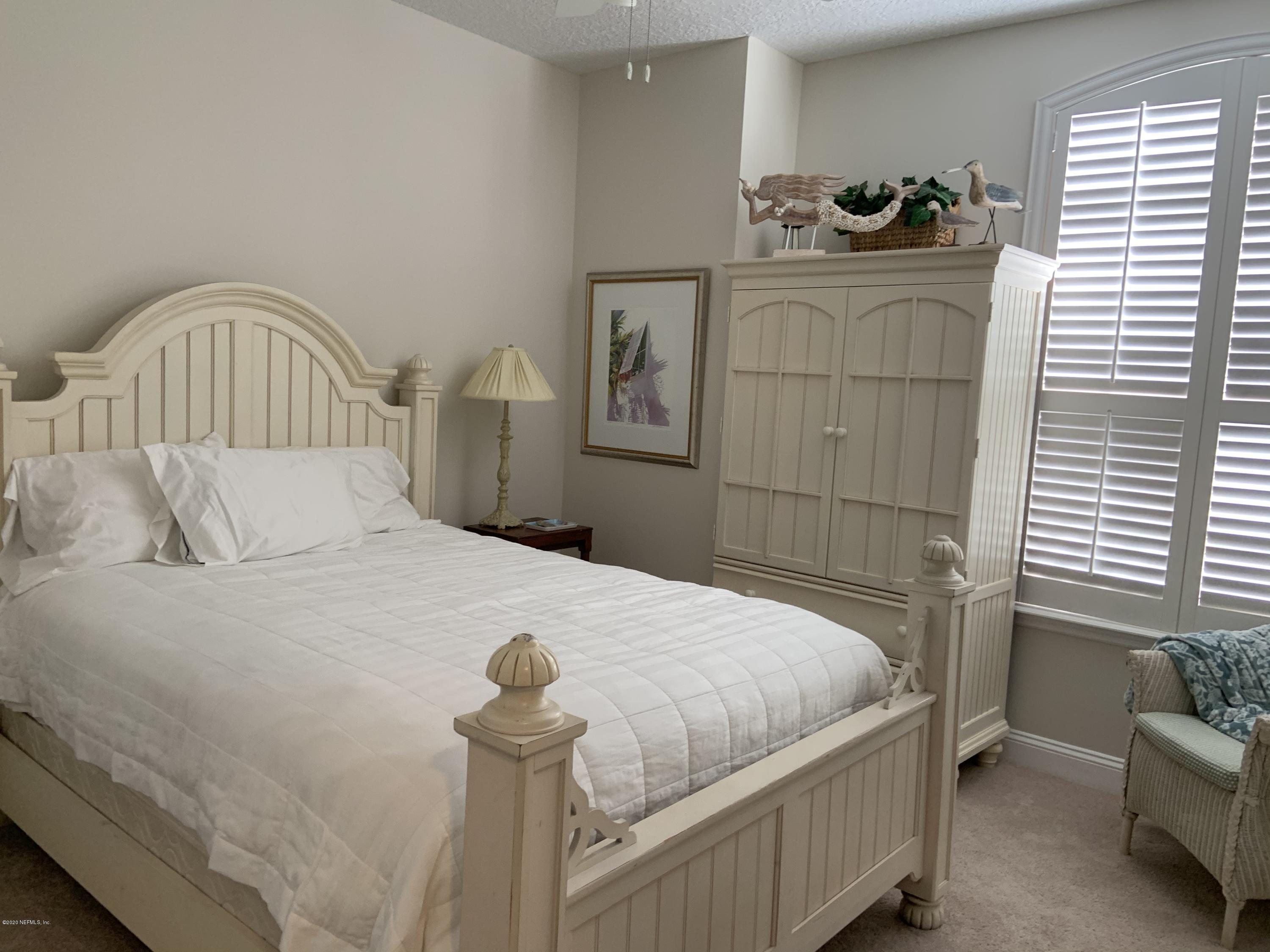 1144 Sandlake Road St. Augustine, FL 32092 - Photo 10 of 11 a bedroom with a bed and a window