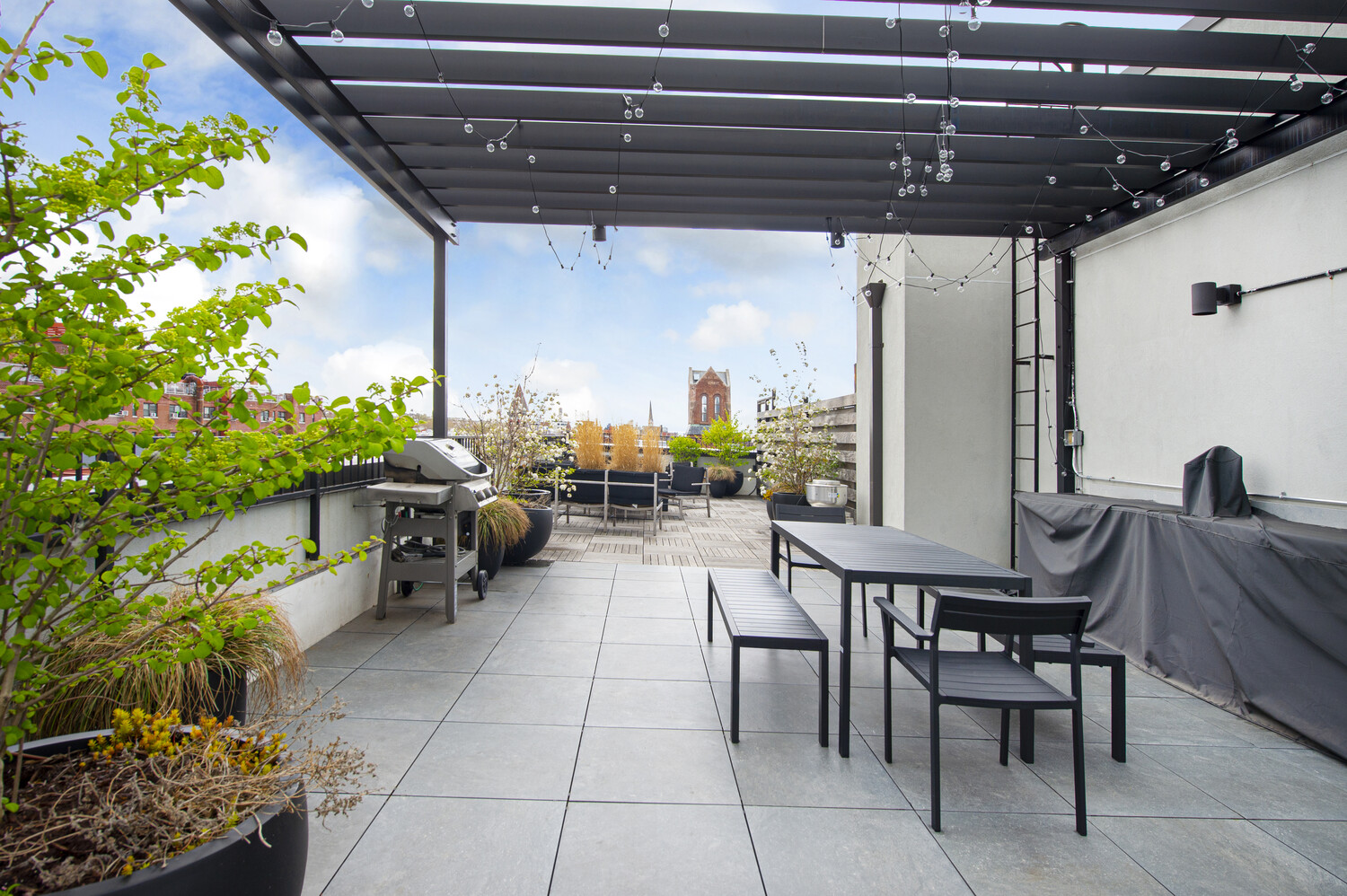 78 Amity Street, Unit 4A Brooklyn, NY 11201 - Photo 7 of 8 a view of a patio with couches and potted plants