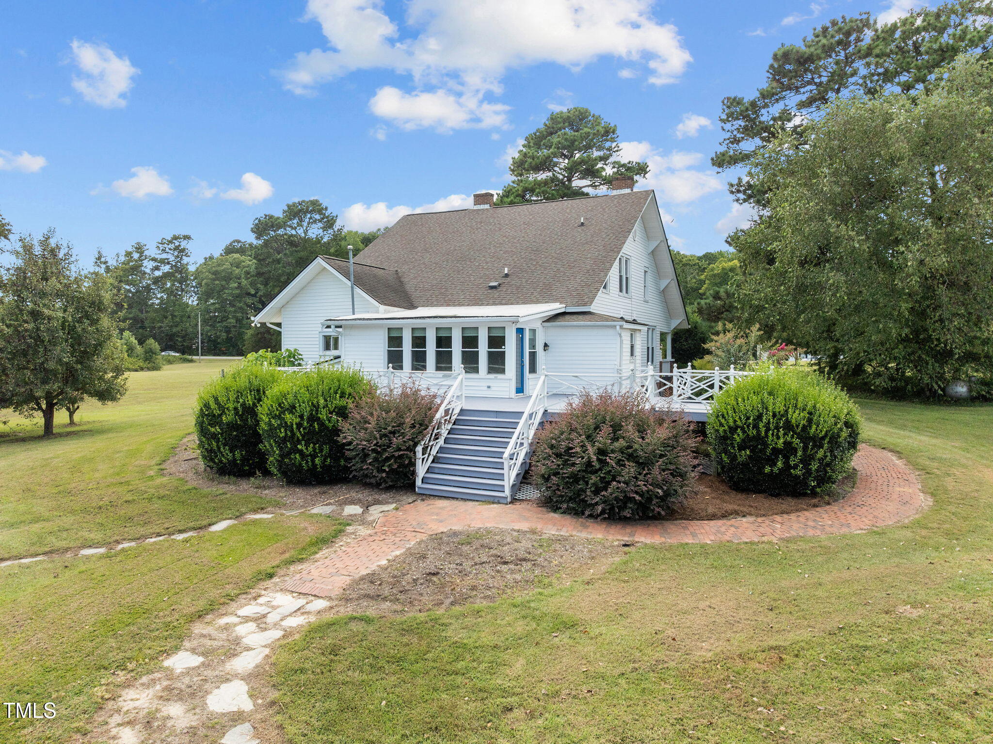 504 Parks Village Road Zebulon, NC 27597 - Photo 29 of 50 a view of a house with a yard and potted plants