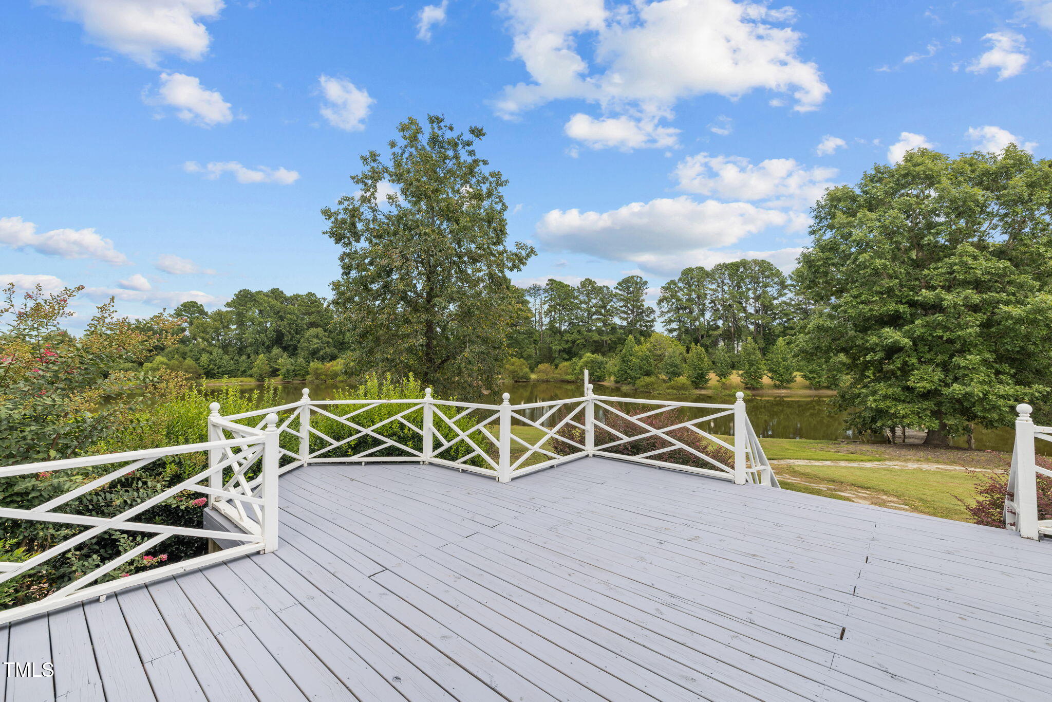 504 Parks Village Road Zebulon, NC 27597 - Photo 31 of 50 a view of a roof deck with wooden floor and fence