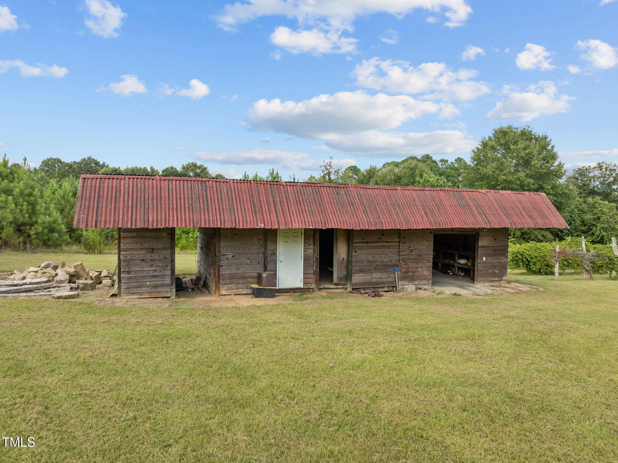 504 Parks Village Road Zebulon, NC 27597 - Photo 36 of 50 a house with swimming pool in front of it