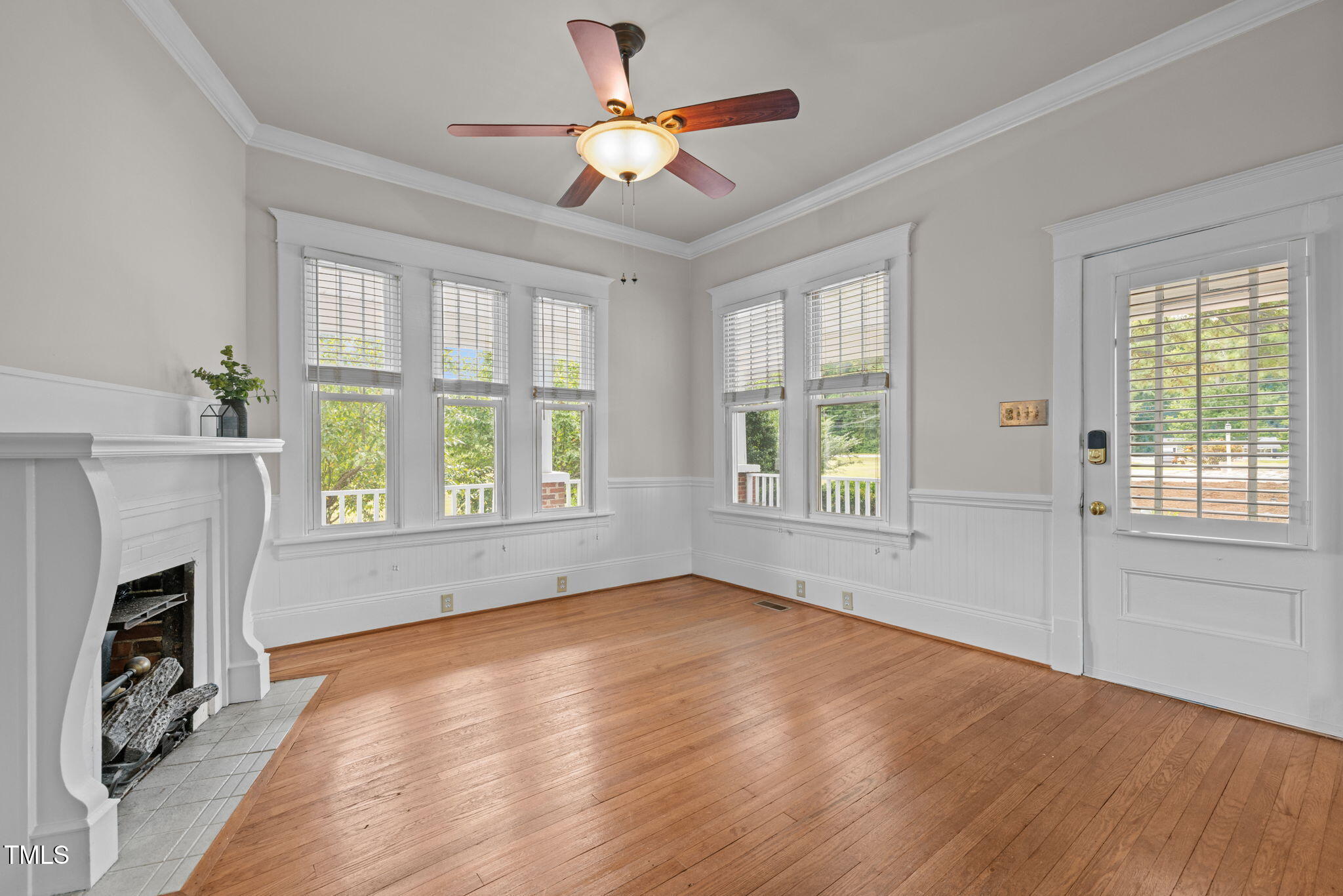 504 Parks Village Road Zebulon, NC 27597 - Photo 4 of 50 a view of an empty room with wooden floor and a window