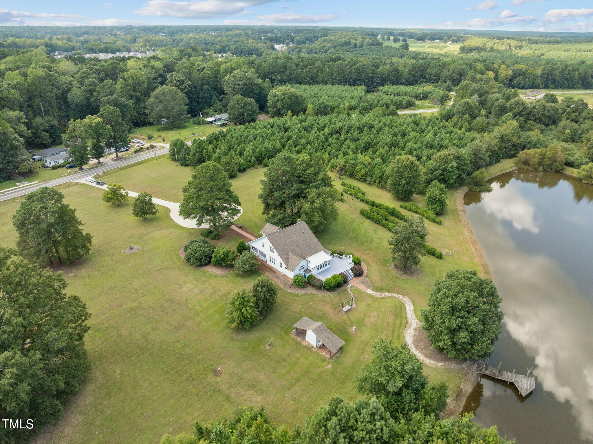 504 Parks Village Road Zebulon, NC 27597 - Photo 44 of 50 an aerial view of a residential houses with outdoor space and trees all around