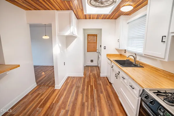 a spacious bathroom with a sink and a large mirror