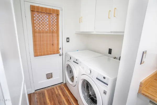 a bed sitting in a bedroom and mirror