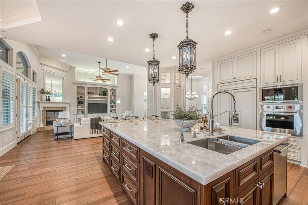 1867 North Rector Avenue Clovis, CA 93619 - Photo 14 of 49 a kitchen with center island a sink appliances and cabinets