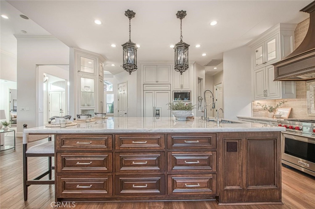 1867 North Rector Avenue Clovis, CA 93619 - Photo 17 of 49 a kitchen with kitchen island granite countertop a sink and cabinets