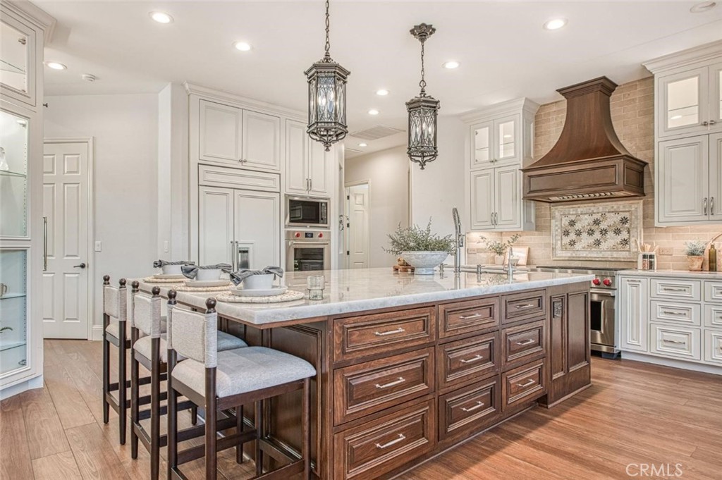 1867 North Rector Avenue Clovis, CA 93619 - Photo 18 of 49 an open kitchen with granite countertop a sink and white cabinets