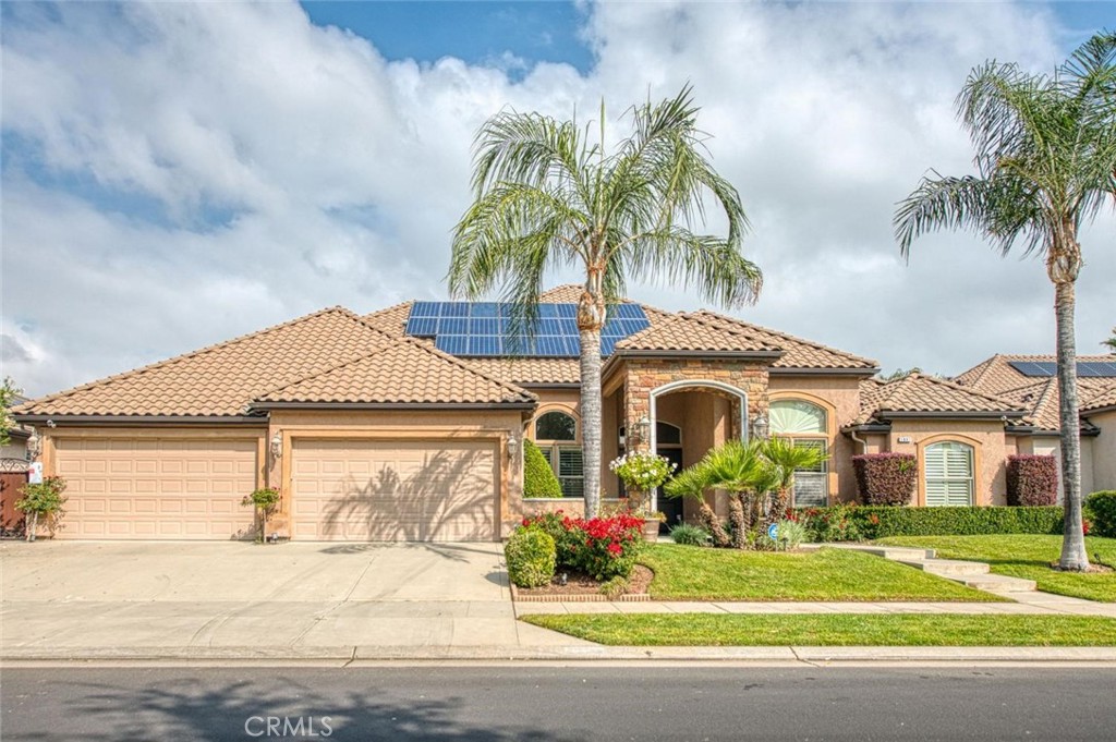 1867 North Rector Avenue Clovis, CA 93619 - Photo 2 of 49 a front view of a house with a garden and entryway