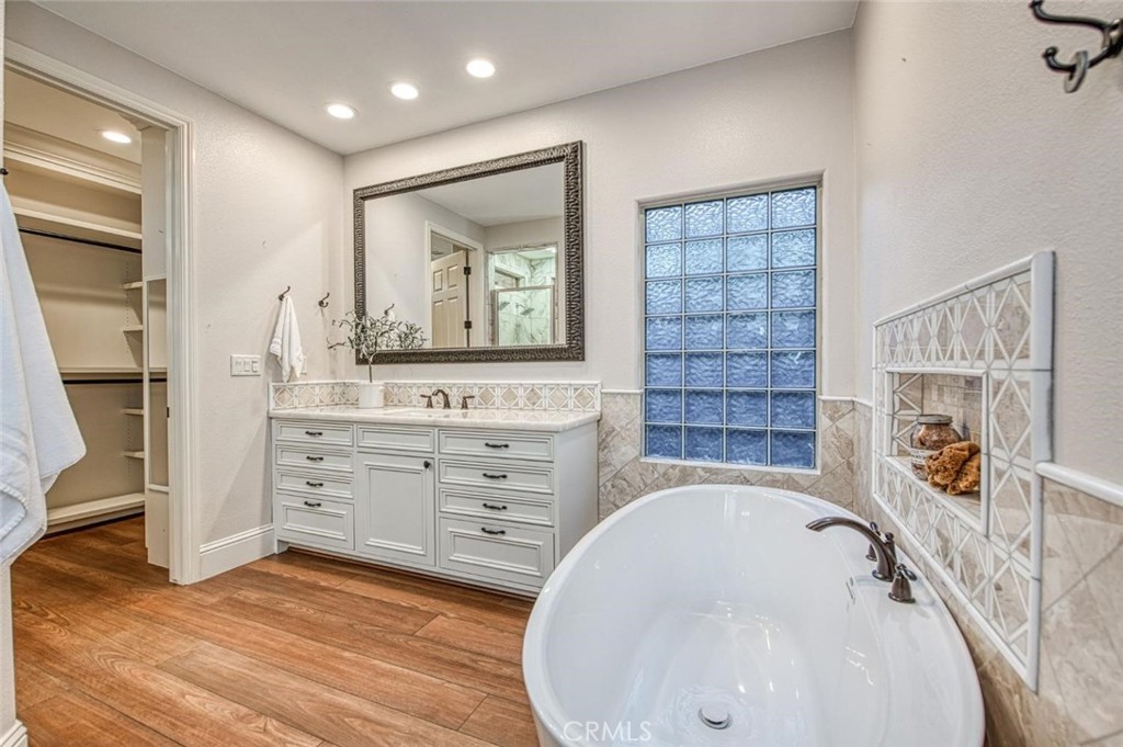 1867 North Rector Avenue Clovis, CA 93619 - Photo 32 of 49 a bathroom with a tub sink and mirror