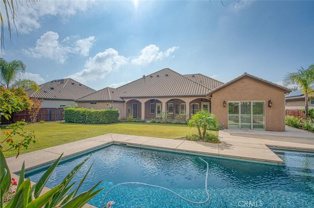 1867 North Rector Avenue Clovis, CA 93619 - Photo 46 of 49 a front view of a house with yard and green space