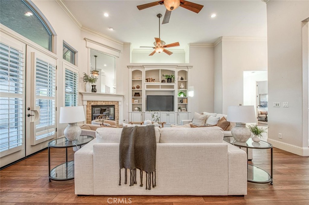 1867 North Rector Avenue Clovis, CA 93619 - Photo 7 of 49 a living room with furniture a fireplace and a chandelier