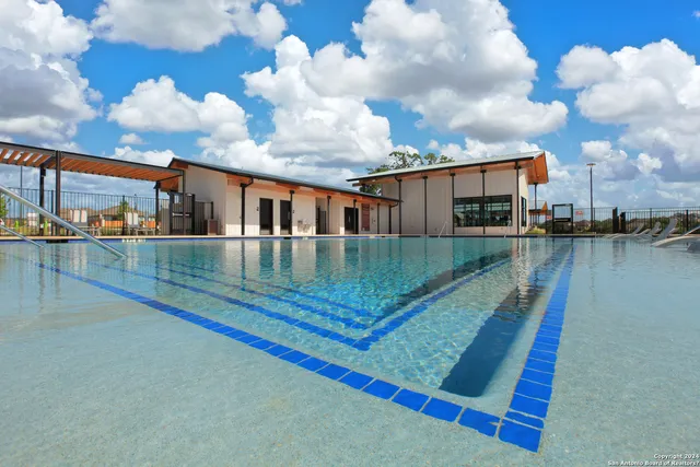 a view of a swimming pool with a lake view